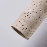 Détail pierre naturelle suspension japonaise wabi-sabi artisanale"